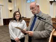 Commissioner David Thornton presents a proclamation to Hannah Bagley, Coordinator of Keep Rome-Floyd Beautiful, for Arbor Day.