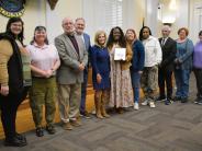 Dr. Tiffany Pauling-Brown with family, friends and the County Commission